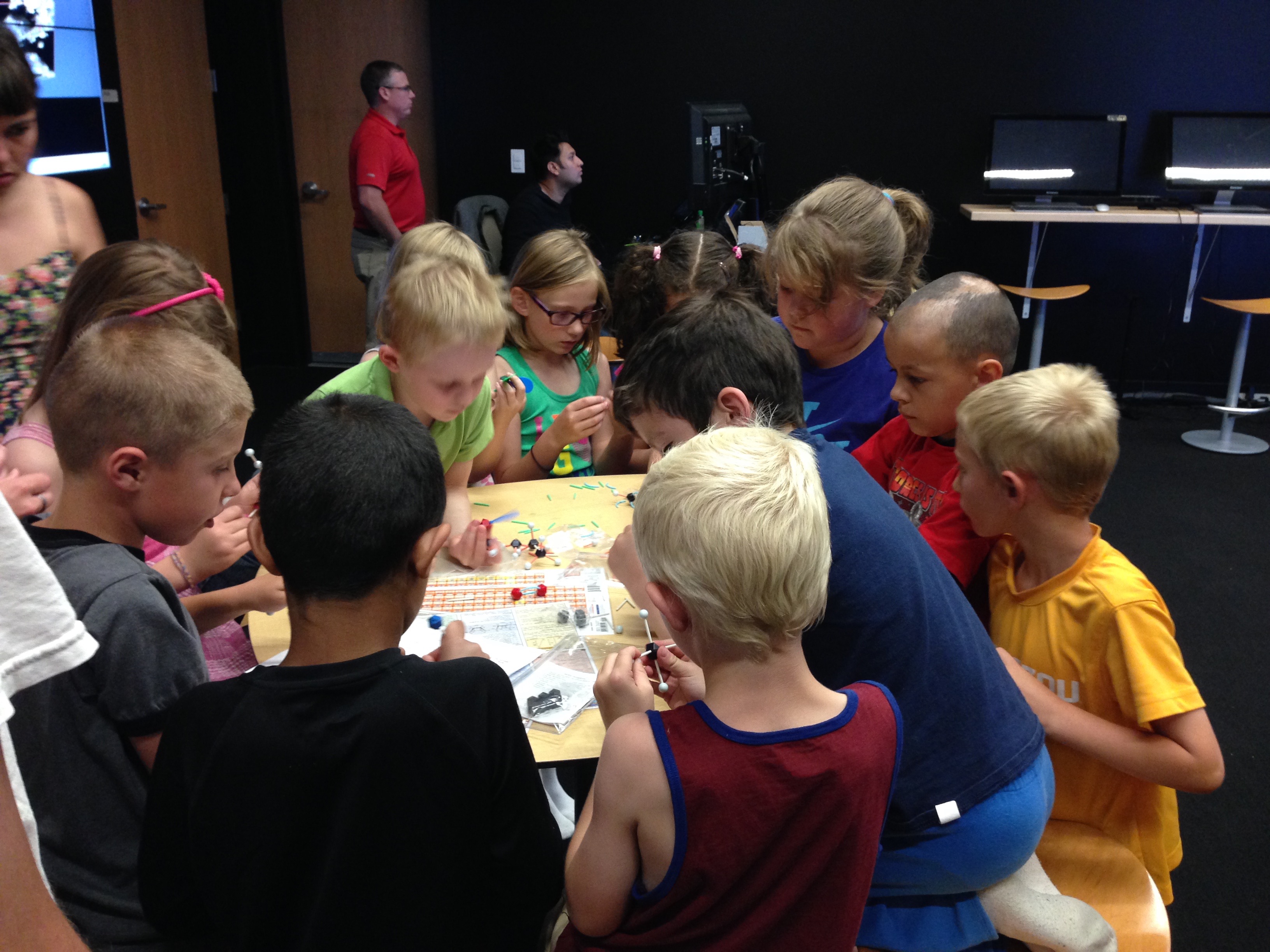 Students building molecules